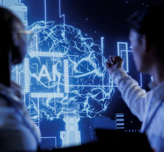 Computer scientists brainstorm ways to use AI cognitive computing to extract usable information from complex data. Data center employees implement artificial intelligence to process massive datasets